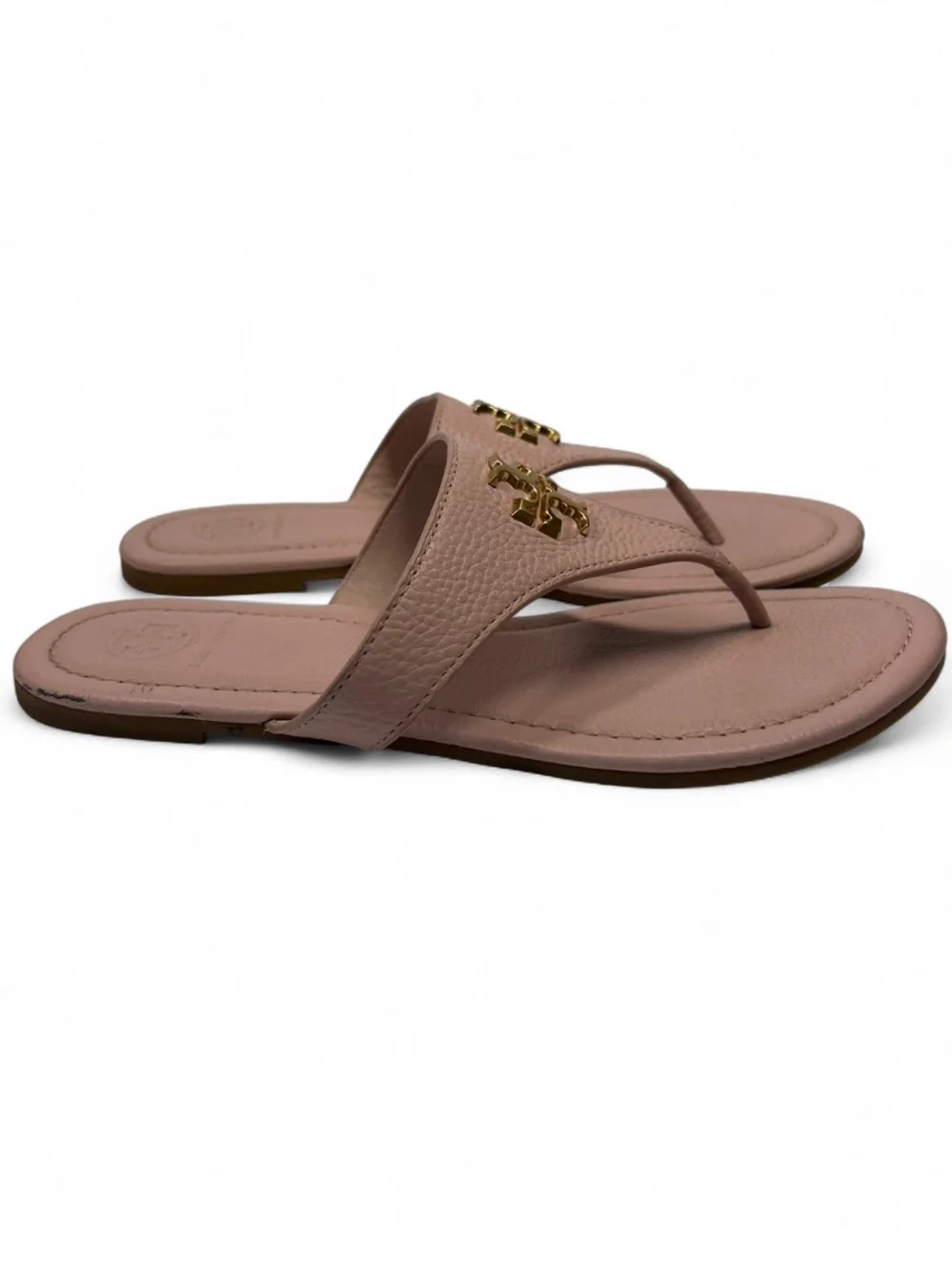 the Tory Burch Jolie Flat Thong Sandals in Sea Shell Pink tumbled leather. 6.5